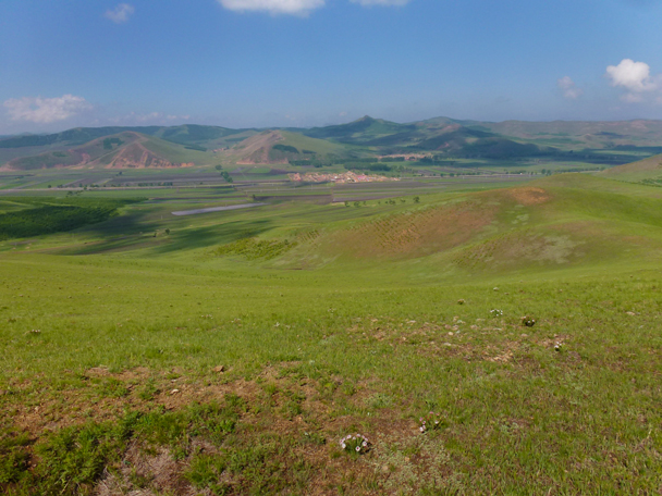 Rolling hills, with small villages in the valleys - Bashang Grasslands, Hebei Province, 2015/06