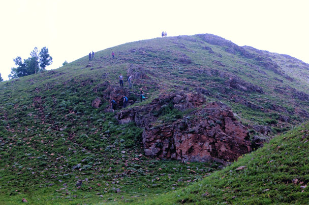 Hikers making their way down from the highest point - Bashang Grasslands trip, July 2016