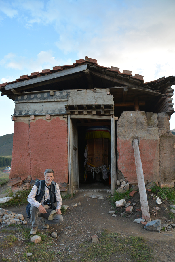 Reinhard in front of a shed that has a big prayer wheel hidden inside - Xiahe, Labrang Monastery, and the Zhagana area in southern Gansu, September 2016