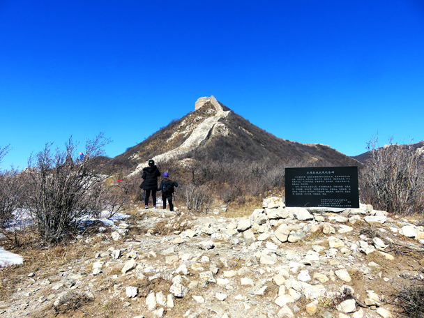 At the base of this section sit a large commemorative stone for soldiers who died here fighting the Japanese army in the late ‘30s. Up on the hill you can see the base of one of the round towers. In the ‘30s this tower was still mostly intact - Zhenbiancheng Great Wall Loop, 2017/2/25