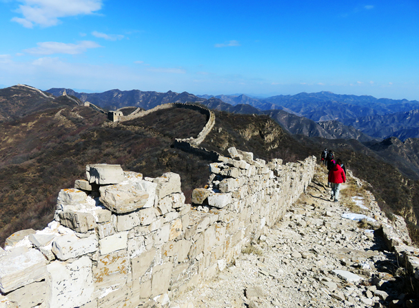 In the middle of the photo is an interesting feature – the line of wall curves up to stay on the highest ground, with a cutting running in front. We think they used the cutting as a source of stone for the wall, and it also makes it more difficult to attack - Zhenbiancheng Great Wall Loop, 2017/2/25