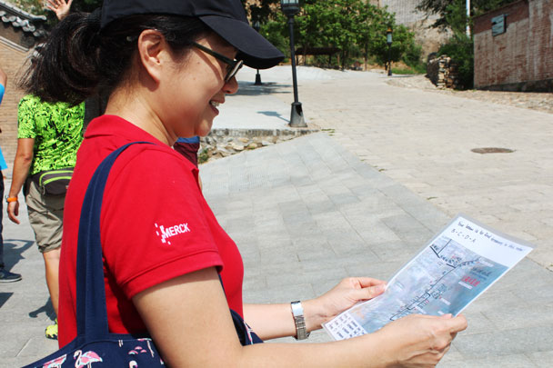 Studying the map to find the hidden treasure - Teambuilding for Merck with Great Wall hike and treasure hunt, 2017/7/7
