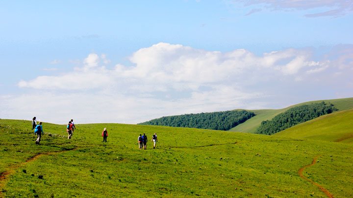 Hiking through the rolling hills of the Bashang Grasslands