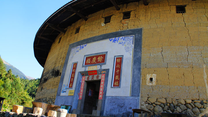 The decorated entrance to a tulou building