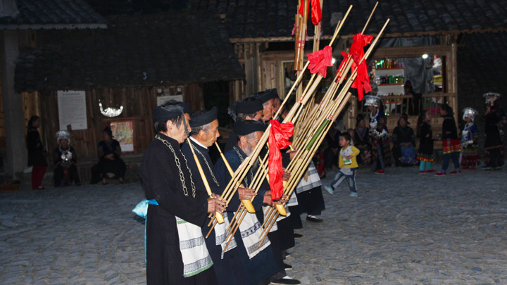 A folk culture performance by 'Long Dress' Miao