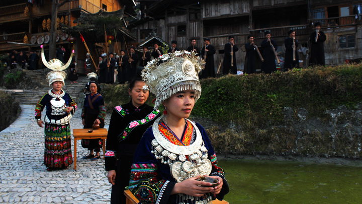 A traditional welcome to a Miao village