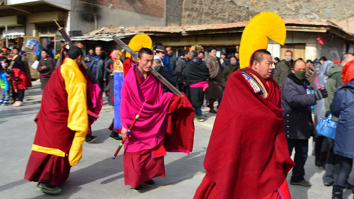 Part of a procession through the streets of Xiahe