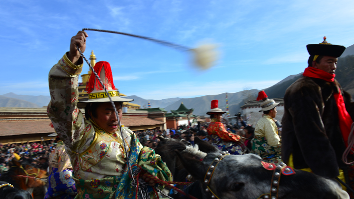 Part of a procession through the streets of Xiahe