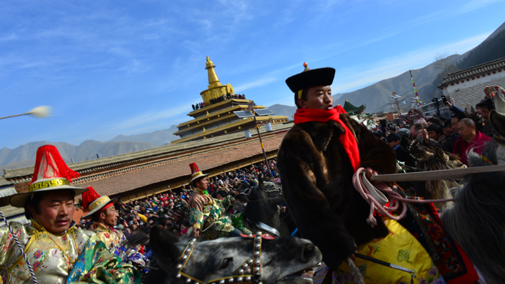 Part of a procession through the streets of Xiahe