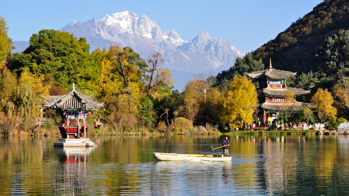 Lijiang's Black Dragon Pool, with the Jade Dragon Snow Mountain seen in the distance