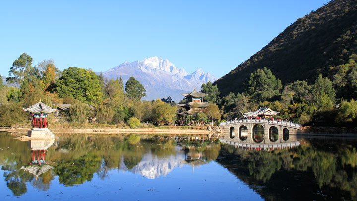 Jade Dragon Snow Mountain, reflected in the waters of Lijiang&rsquo;s Black Dragon Pool.