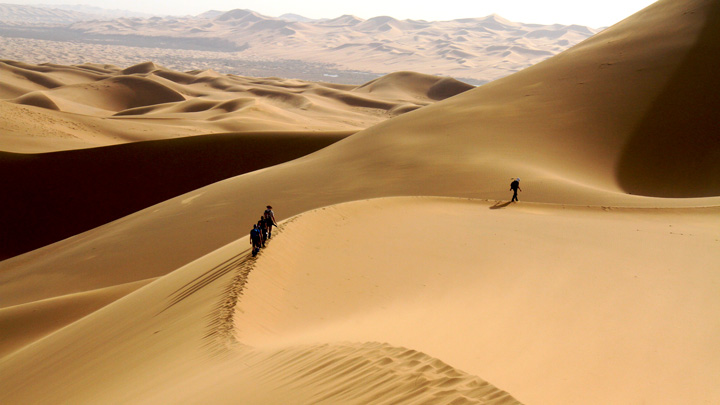 Hiking through the huge dunes of the Tengger Desert in Inner Mongolia.