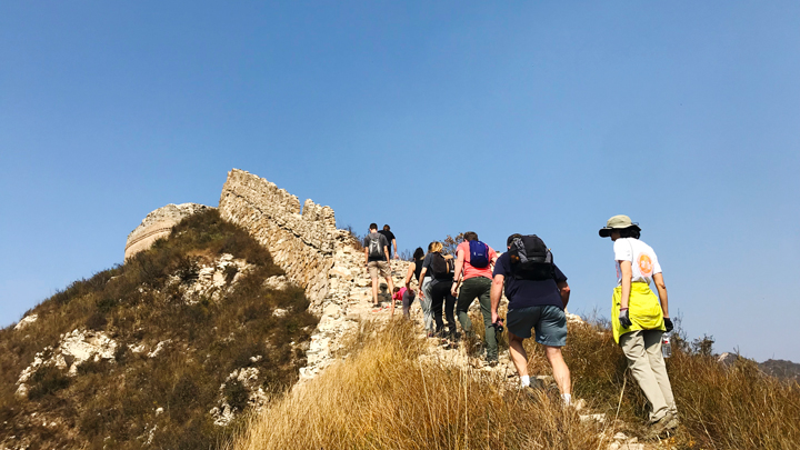 Hiking over a crest on the Great Wall at Zhenbiancheng